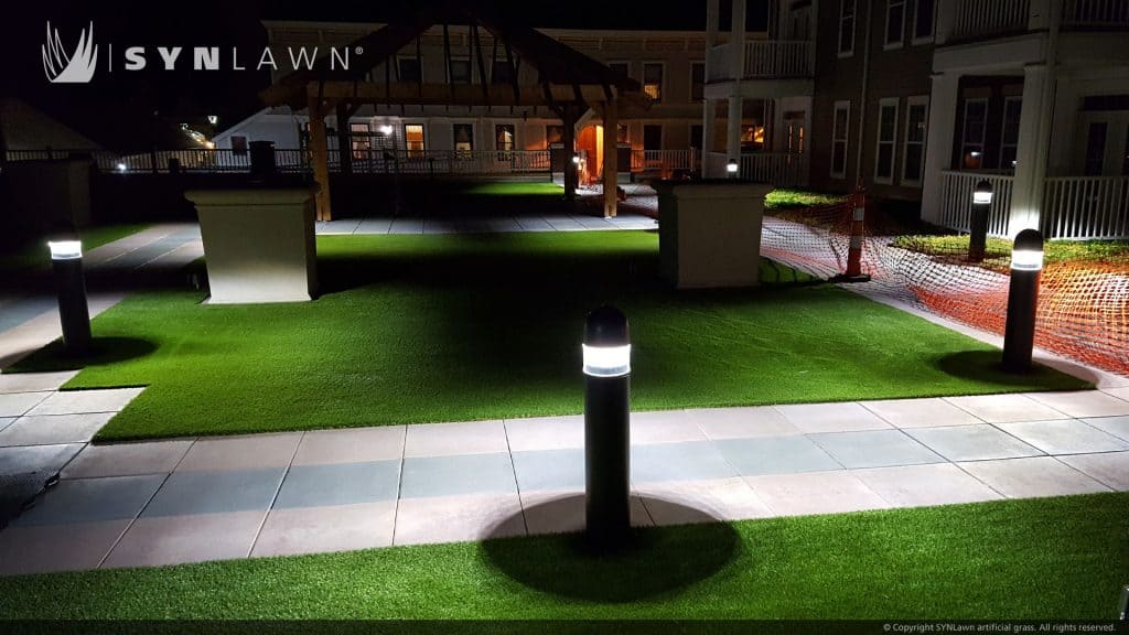 SYNLawn artificial grass commercial condo apartment courtyard at night