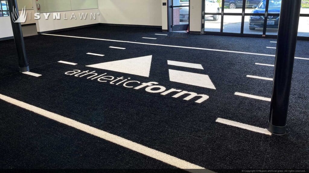 Indoor athletic weight room with artificial grass