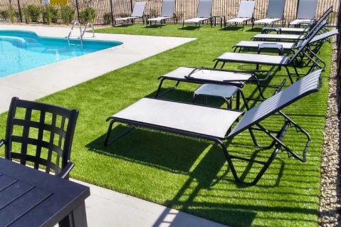 Community pool area with artificial grass